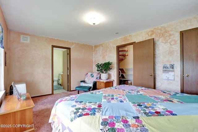 2643 S Rory Cir, Big Lake, AK 99654 - bedroom featuring carpet, wallpapered walls, a spacious closet, ensuite bath, and baseboards