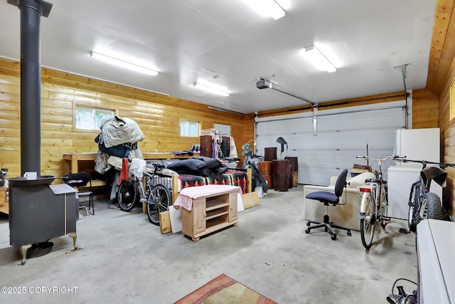2643 S Rory Cir, Big Lake, AK 99654 - garage with a garage door opener and a wood stove