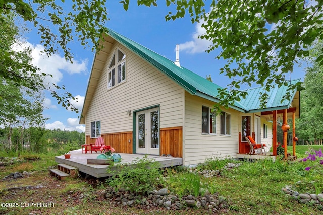2643 S Rory Cir, Big Lake, AK 99654 - back of property with metal roof, french doors, and a deck