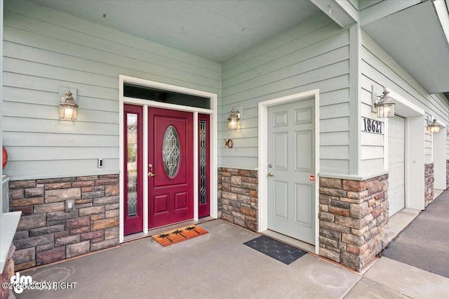 18627 Mountain Plover Cir, Anchorage, AK 99516 - property entrance featuring stone siding and covered porch