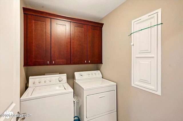 18627 Mountain Plover Cir, Anchorage, AK 99516 - laundry room featuring washer and clothes dryer and cabinet space