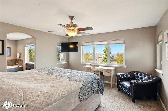 18627 Mountain Plover Cir, Anchorage, AK 99516 - bedroom with arched walkways, multiple windows, carpet, and a ceiling fan