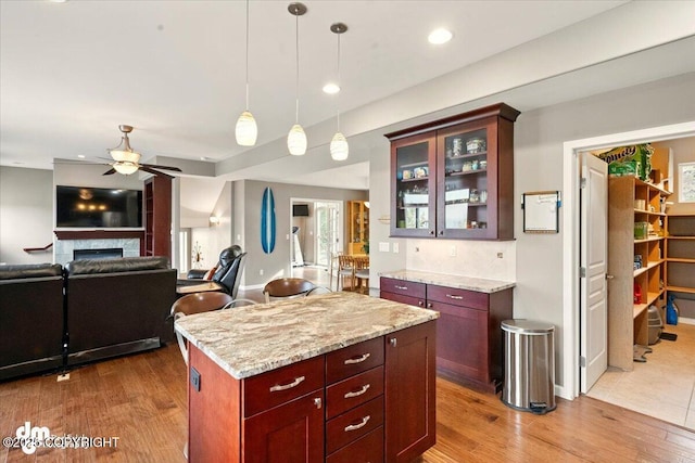 18627 Mountain Plover Cir, Anchorage, AK 99516 - kitchen featuring ceiling fan, wood finished floors, decorative light fixtures, open floor plan, and recessed lighting