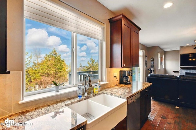 18627 Mountain Plover Cir, Anchorage, AK 99516 - kitchen with stainless steel dishwasher, open floor plan, healthy amount of natural light, light stone countertops, and recessed lighting