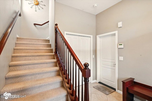 18627 Mountain Plover Cir, Anchorage, AK 99516 - stairs featuring tile patterned flooring and baseboards