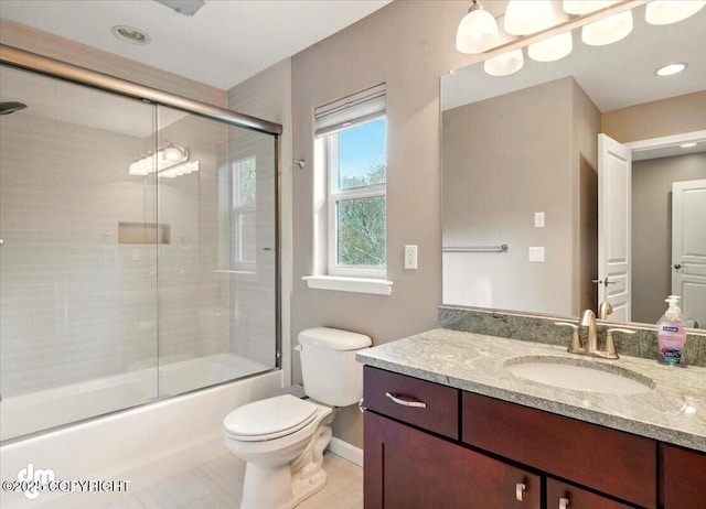 18627 Mountain Plover Cir, Anchorage, AK 99516 - bathroom featuring vanity, bath / shower combo with glass door, tile patterned floors, and recessed lighting