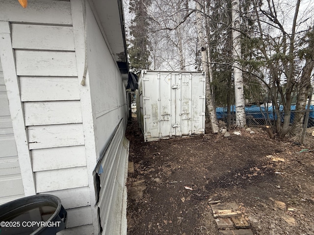 view of property exterior featuring fence