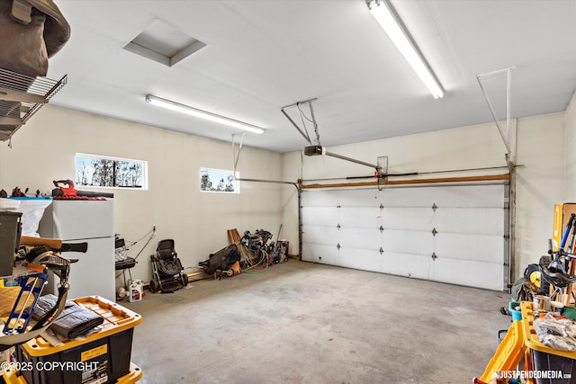 garage featuring a garage door opener