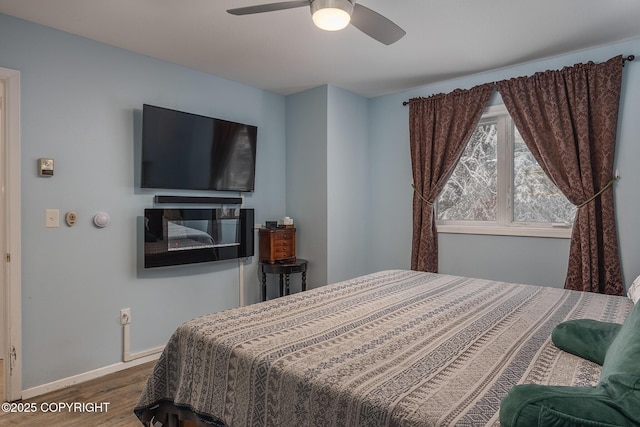 3585 Hoonah Dr, North Pole, AK 99705 - bedroom featuring ceiling fan, baseboards, and wood finished floors