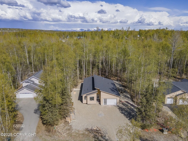 view from above of property featuring a forest