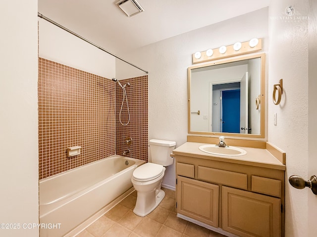 bathroom with tile patterned flooring, toilet, shower / bath combination, vanity, and baseboards
