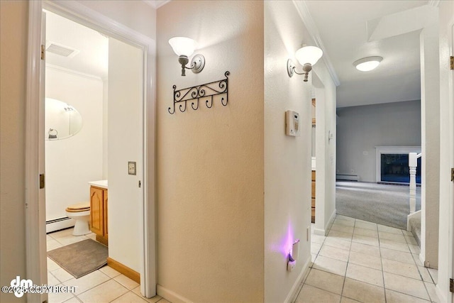 6508 Cimarron Cir, Anchorage, AK 99504 - hall featuring light tile patterned floors, a baseboard heating unit, ornamental molding, baseboard heating, and baseboards