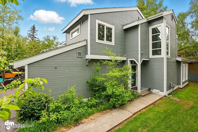 6508 Cimarron Cir, Anchorage, AK 99504 - view of side of property with a lawn