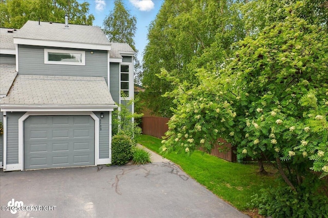 6508 Cimarron Cir, Anchorage, AK 99504 - view of front of house featuring asphalt driveway and an attached garage