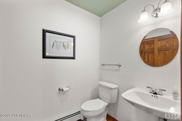 half bath with toilet and a sink