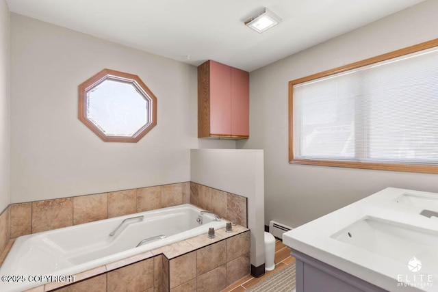 full bathroom featuring a garden tub, toilet, baseboard heating, and a sink