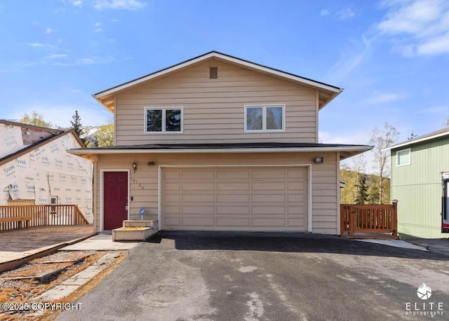 view of front of house with an attached garage and driveway