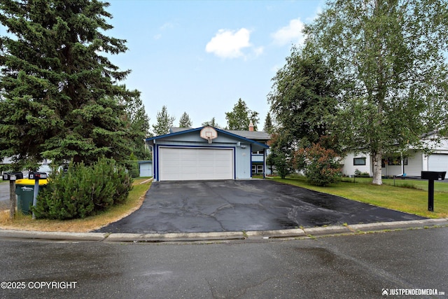 3520 Glenn-Don Cir, Anchorage, AK 99504 - view of front of property featuring asphalt driveway, a garage, a front lawn, and a chimney