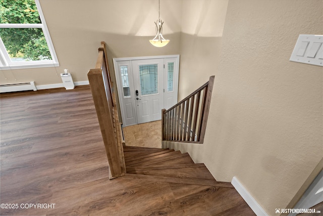 3520 Glenn-Don Cir, Anchorage, AK 99504 - entrance foyer featuring a baseboard radiator, dark wood-style floors, and a textured wall