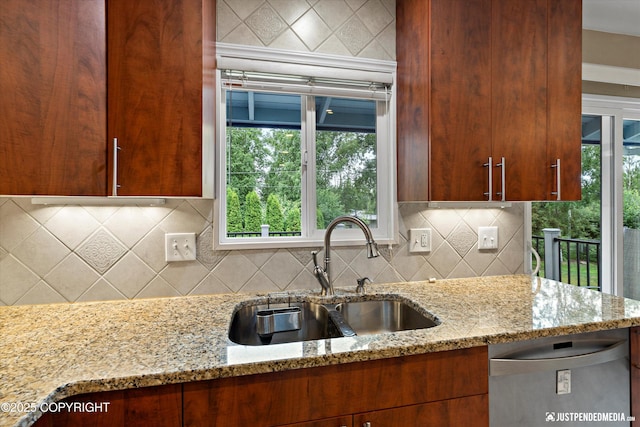 3520 Glenn-Don Cir, Anchorage, AK 99504 - kitchen featuring stainless steel dishwasher, light stone countertops, and healthy amount of natural light