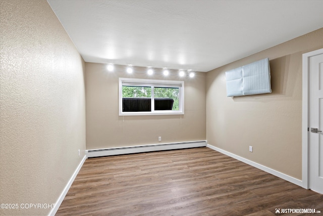 3520 Glenn-Don Cir, Anchorage, AK 99504 - empty room with a baseboard radiator, wood finished floors, and a textured wall