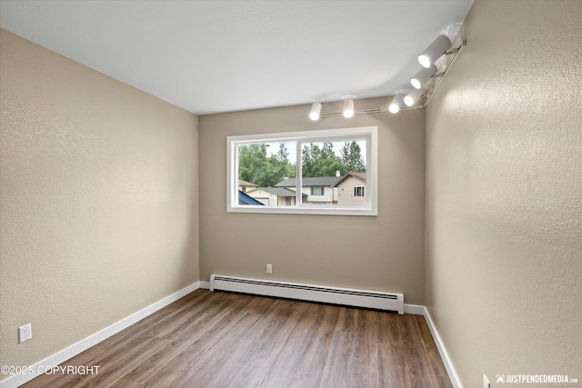 3520 Glenn-Don Cir, Anchorage, AK 99504 - unfurnished room featuring a baseboard radiator and wood finished floors