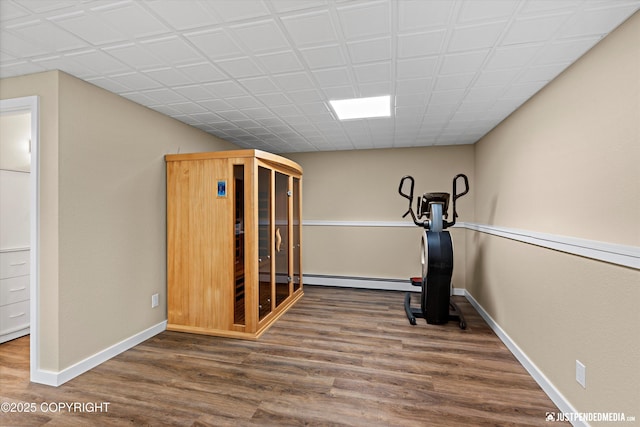 3520 Glenn-Don Cir, Anchorage, AK 99504 - workout area featuring baseboard heating and wood finished floors