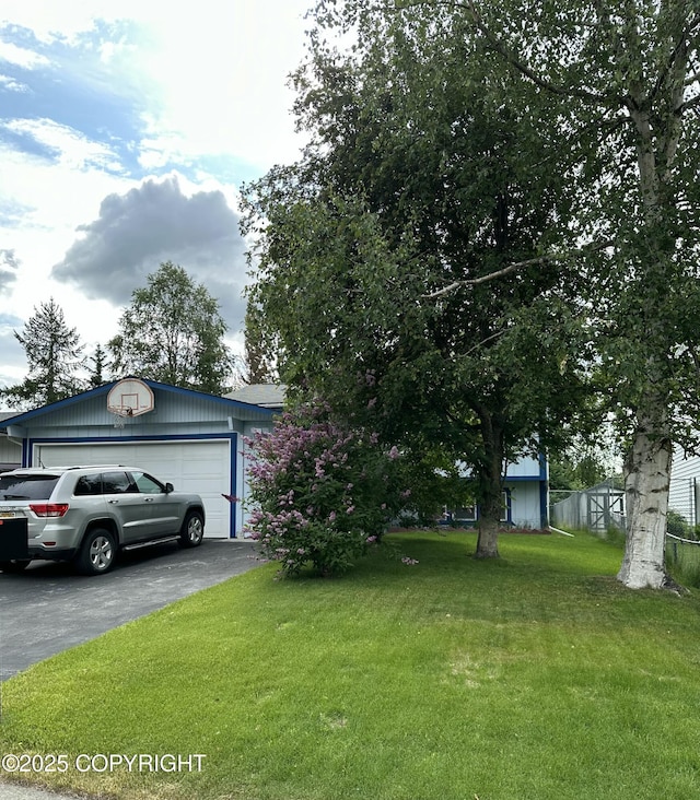 3520 Glenn-Don Cir, Anchorage, AK 99504 - view of front of home featuring a front yard and a garage