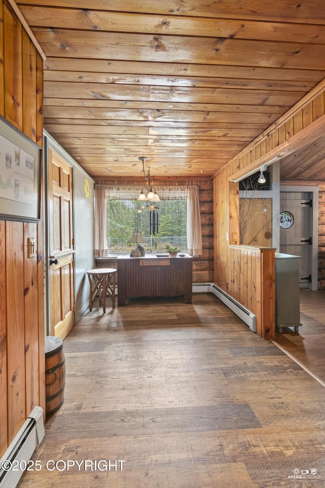 265 Ames Rd, Kenai, AK 99611 - dining space with a baseboard radiator, wood ceiling, hardwood / wood-style flooring, and a chandelier