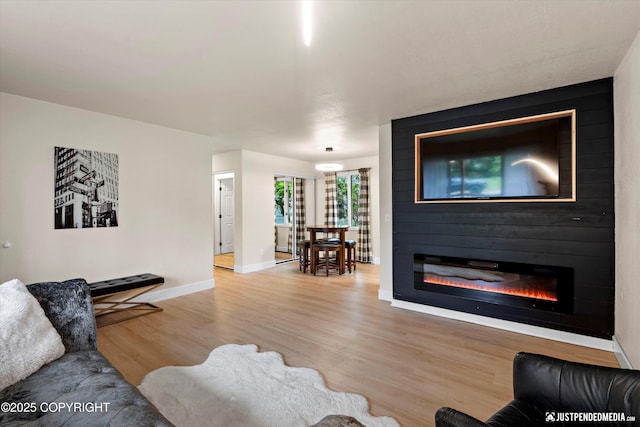 3722 E 19th Ave, Anchorage, AK 99508 - living area with wood finished floors and a fireplace