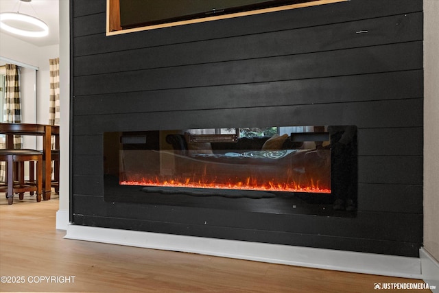 3722 E 19th Ave, Anchorage, AK 99508 - detailed view of wood finished floors and a glass covered fireplace