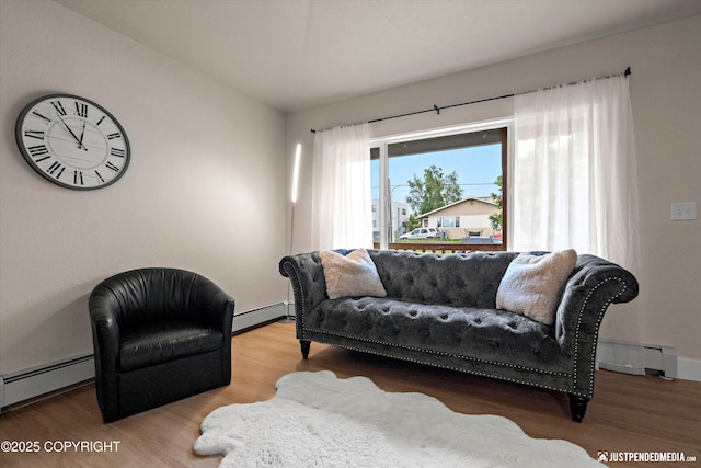 3722 E 19th Ave, Anchorage, AK 99508 - living area featuring a baseboard heating unit and wood finished floors