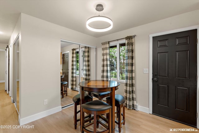 3722 E 19th Ave, Anchorage, AK 99508 - dining room featuring light wood-type flooring and baseboards