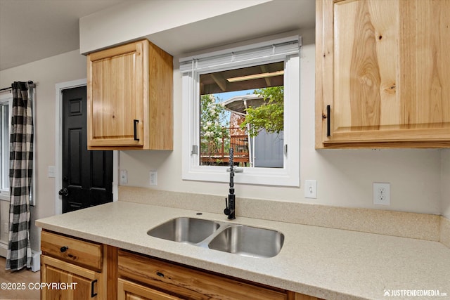 3722 E 19th Ave, Anchorage, AK 99508 - kitchen with light countertops and light brown cabinetry