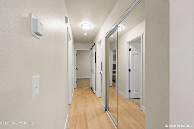 3722 E 19th Ave, Anchorage, AK 99508 - hall featuring light wood-style flooring and baseboards