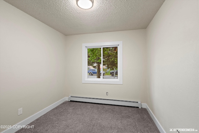 3722 E 19th Ave, Anchorage, AK 99508 - spare room with a baseboard heating unit, carpet, and a textured ceiling