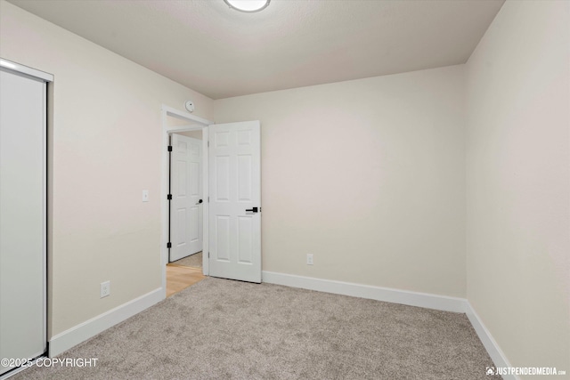 3722 E 19th Ave, Anchorage, AK 99508 - unfurnished bedroom featuring carpet floors and a closet