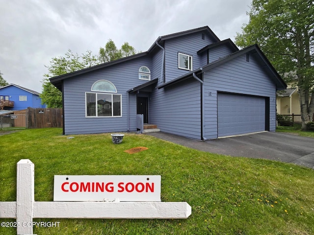 748 Winter Haven St, Anchorage, AK 99504 - view of front of home featuring asphalt driveway and an attached garage