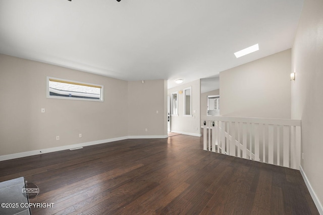 2563 La Honda Dr, Anchorage, AK 99517 - spare room with wood finished floors and baseboards