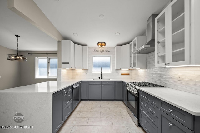 2563 La Honda Dr, Anchorage, AK 99517 - kitchen with appliances with stainless steel finishes, a sink, backsplash, white cabinets, and light countertops