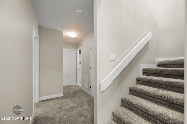 2563 La Honda Dr, Anchorage, AK 99517 - staircase featuring carpet and baseboards