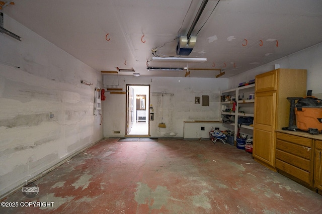 2563 La Honda Dr, Anchorage, AK 99517 - garage featuring a garage door opener