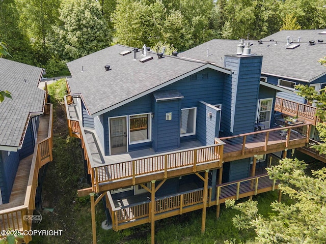 2563 La Honda Dr, Anchorage, AK 99517 - rear view of house featuring a chimney, a shingled roof, and a wooden deck