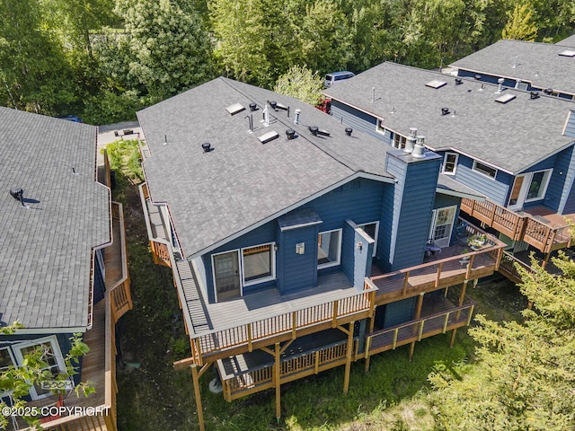 2563 La Honda Dr, Anchorage, AK 99517 - rear view of property with a chimney, roof with shingles, and a deck