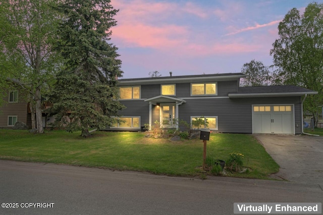 3921 Patricia Ln, Anchorage, AK 99504 - split foyer home featuring an attached garage, driveway, and a front lawn