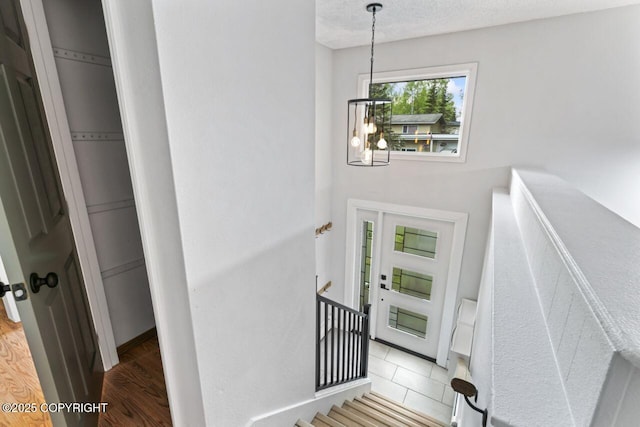 3921 Patricia Ln, Anchorage, AK 99504 - staircase with a chandelier