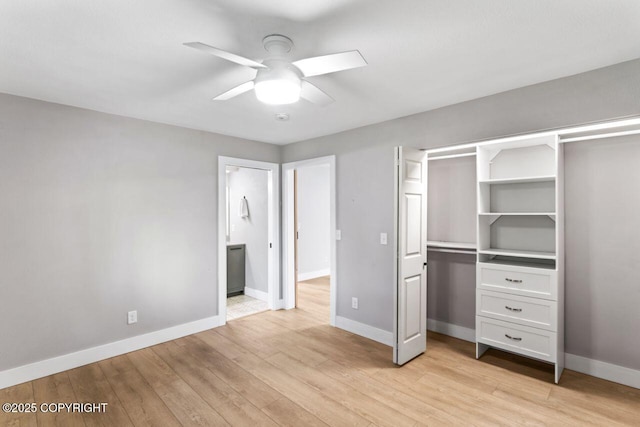 3921 Patricia Ln, Anchorage, AK 99504 - unfurnished bedroom with light wood-style flooring, baseboards, ensuite bath, and a ceiling fan