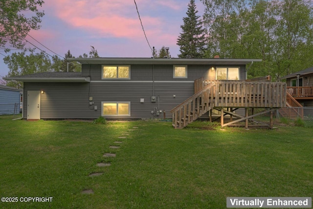 3921 Patricia Ln, Anchorage, AK 99504 - back of house at dusk featuring stairs, a wooden deck, and a lawn