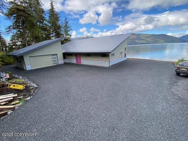 exterior space with metal roof and a mountain view