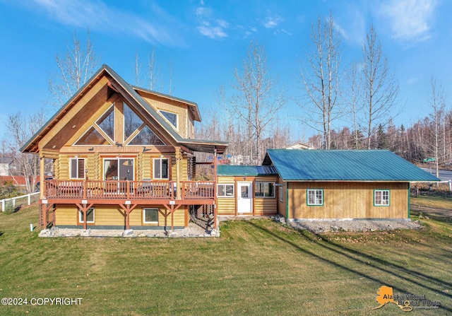 19180 Beverly Ave, Chugiak, AK 99567 - back of property with a wooden deck, a metal roof, a yard, and log exterior